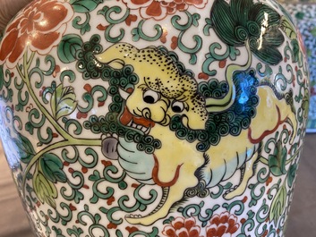 A pair of Chinese famille verte 'Buddhist lions' vases, 19th C.