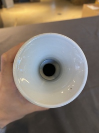 A Chinese blue and white rouleau vase with antiquities, Kangxi