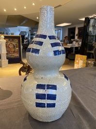 A Chinese blue and white crackle-glazed double gourd 'trigrams' vase, probably  Ming