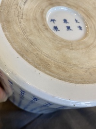 A Chinese blue, white and copper-red inscribed brush pot, Kangxi mark, 19/20th C.