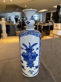 A Chinese blue and white rouleau vase with antiquities, Kangxi