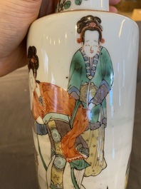 A Chinese famille verte rouleau vase on wooden 'lotus' stand, probably 19th C.