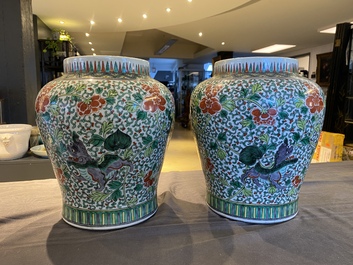 A pair of Chinese famille verte 'Buddhist lions' vases, 19th C.