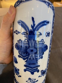 A Chinese blue and white rouleau vase with antiquities, Kangxi