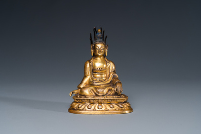 A small Sino-Tibetan gilt bronze Buddha, 19th C.