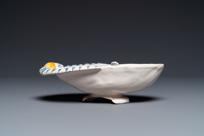 A polychrome French faience oval basin with a bathing woman, Nevers, 17th C.
