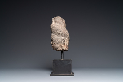 A stone head of Avalokitesvara, Khmer, Cambodia