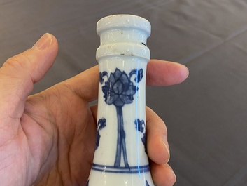 A pair of Chinese blue and white 'peony scroll' pharmacy bottles, Kangxi