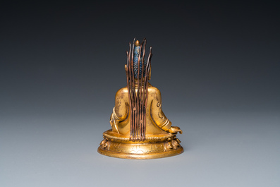 A small Sino-Tibetan gilt bronze Buddha, 19th C.