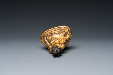 A small Sino-Tibetan gilt bronze Buddha, 19th C.