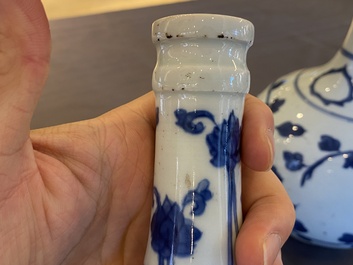 A pair of Chinese blue and white 'peony scroll' pharmacy bottles, Kangxi
