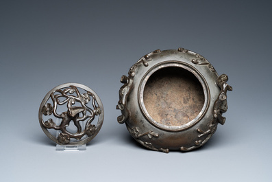 A Chinese bronze tripod censer and cover, 19th C.