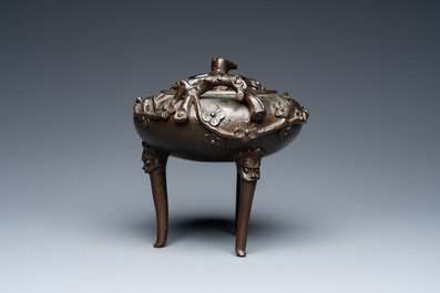 A Chinese bronze tripod censer and cover, 19th C.