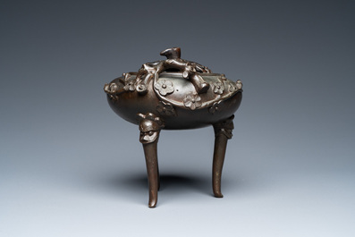 A Chinese bronze tripod censer and cover, 19th C.