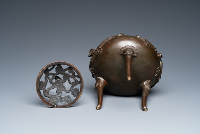 A Chinese bronze tripod censer and cover, 19th C.