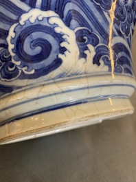 A Chinese blue and white vase with rocks in a wavy sea, Qianlong/Jiaqing