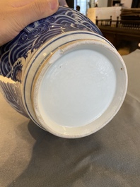 A Chinese blue and white vase with rocks in a wavy sea, Qianlong/Jiaqing
