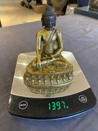 A Sino-Tibetan gilt bronze Buddha, 18th C.