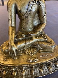 A Sino-Tibetan gilt bronze Buddha, 18th C.