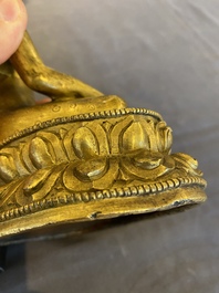 A Sino-Tibetan gilt bronze Buddha, 18th C.