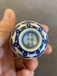 A Chinese blue and white cup with floral design, Kangxi mark, 19/20th C.
