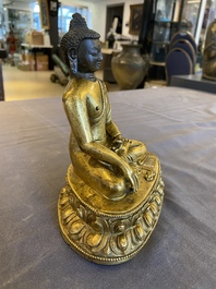 A Sino-Tibetan gilt bronze Buddha, 18th C.