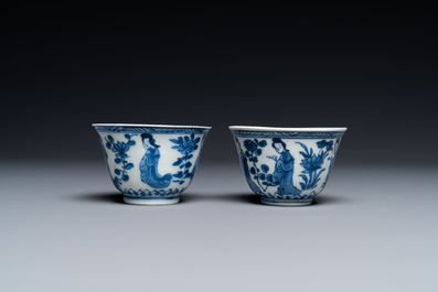 A Chinese blue and white bowl and a pair of cups and saucers, Kangxi