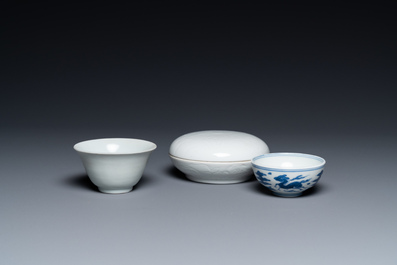A Chinese white-glazed bowl, a small blue and white bowl and a covered box with incised design, Ming and Qing