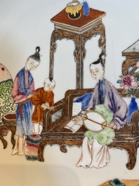 A fine Chinese famille rose eggshell porcelain plate with a boy and two governesses in an interior, Yongzheng