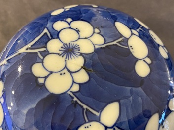 A pair of Chinese blue and white jars and covers, 19th C.