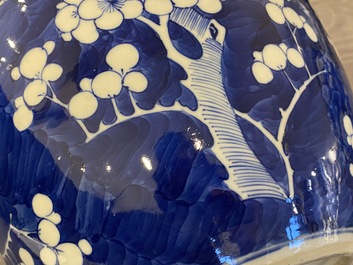 A pair of Chinese blue and white jars and covers, 19th C.