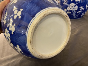 A pair of Chinese blue and white jars and covers, 19th C.