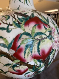 A Chinese famille rose 'nine peaches' bottle vase, Qianlong mark, 19th C.