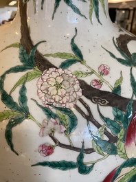 A Chinese famille rose 'nine peaches' bottle vase, Qianlong mark, 19th C.