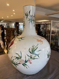 A Chinese famille rose 'nine peaches' bottle vase, Qianlong mark, 19th C.