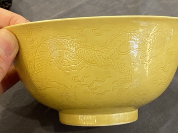 Een Chinese monochrome gele kom met anhua drakendecor, Qianlong merk maar wellicht later