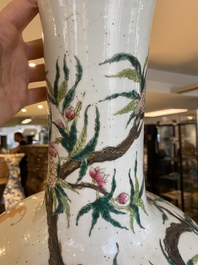A Chinese famille rose 'nine peaches' bottle vase, Qianlong mark, 19th C.