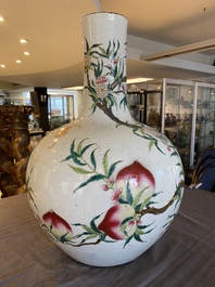A Chinese famille rose 'nine peaches' bottle vase, Qianlong mark, 19th C.