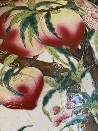 A Chinese famille rose 'nine peaches' bottle vase, Qianlong mark, 19th C.