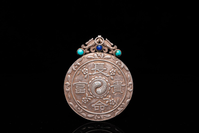 A Chinese reticulated jade 'three peacocks' carving in silver pendant, Qing