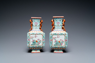 A pair of Chinese famille rose turquoise-ground vases, Qianlong mark, 19/20th C.