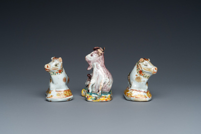 Three polychrome and cold-painted Dutch Delft miniatures of a buckrider and two cows, 18th C.