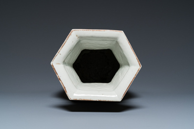 A hexagonal Chinese famille rose vase with antiquities and peacocks, 19th C.