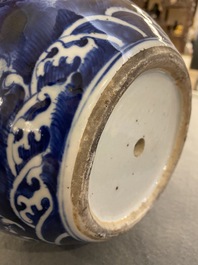 A Chinese blue and white 'dragons' bottle vase, 19th C.