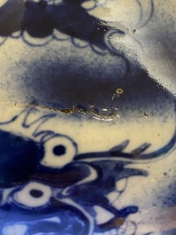 A Chinese blue and white 'dragons' bottle vase, 19th C.