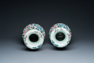 A pair of Chinese famille rose 'court scene' vases, 19th C.