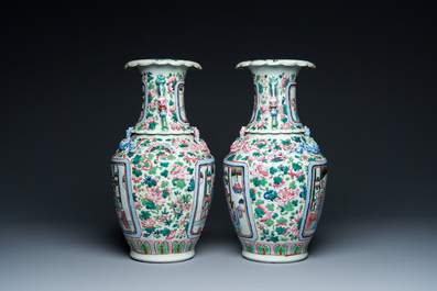 A pair of Chinese famille rose 'court scene' vases, 19th C.