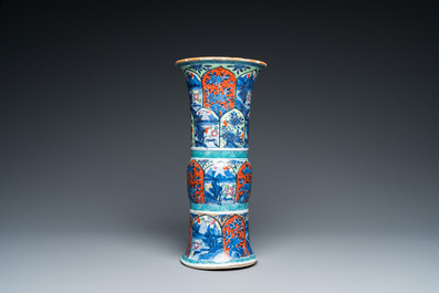 A Chinese blue and white 'gu' vase with European clobbered design, Kangxi