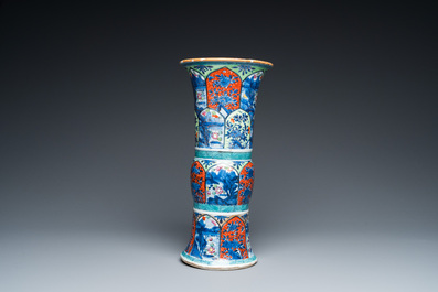 A Chinese blue and white 'gu' vase with European clobbered design, Kangxi