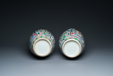 A pair of Chinese famille rose 'court scene' vases, 19th C.